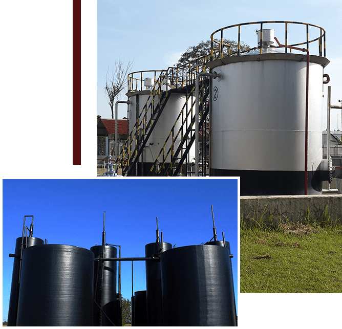 A picture of two large tanks in the middle of a field.